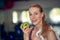 Attractive natural young woman athlete holding a fresh crisp green apple