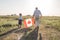 Attractive old senior  man and grahdson holding Canadian Flag. National holiday. Grandpa retiree. Retirement parent