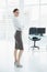 Attractive peaceful businesswoman posing standing in her office