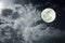 Attractive photo of a nighttime sky with cloudy and bright full moon. Beautiful nature use as background. Outdoors.