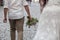 Attractive plus size bride in white dress on walk with groome