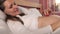 Attractive pregnant woman fondle her tummy lying in bed