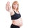Attractive pregnant woman showing stop or stay gesture with palm