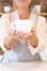 An Attractive professional craftswoman offering a cup of tea or coffee