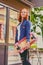 The attractive redhead female holds Longboard.