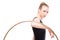 Attractive rhythmic gymnast in bodysuit holding hoop and looking at camera