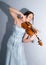 Attractive romantic girl playing violin