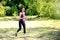 Attractive running young woman outdoor. Workout in the park, forest, nature.