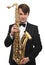 Attractive saxophonist with a saxophone in suit.