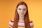 Attractive self-assured redhead girl encouraging herself look mirror confident prepare interview speech standing orange