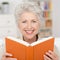 Attractive senior woman reading a book