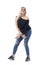 Attractive sexy middle aged blonde hair woman dancing wearing jeans and off shoulder black shirt.