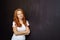 Attractive slender redhead woman