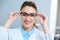 attractive smiling ophthalmologist wearing