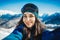 Attractive snowboard girl smiling and making selfie on mountain background.