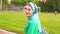 Attractive sporty muslim girl in hijab walks around the stadium and smiles at the camera,slow mo
