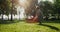 Attractive stylish man sitting in squat in park. Relaxed guy look in distance