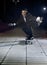 Attractive and successful businessman riding skateboard wearing suit and necktie