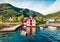 Attractive summer view of typical Norwegian village Jondal, on the shore of fjord. Sunny morning panorama of countryside, Norway,