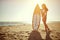 Attractive surf girl posing on the beach