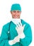 Attractive surgeon wearing surgical gloves