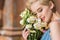 attractive tender girl with bouquet