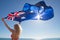 Attractive woman Australian flag at ocean