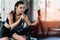 Attractive woman biking in the gym, exercising legs doing cardio workout cycling bikes.