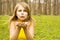 Attractive woman blowing kiss in spring nature