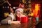 Attractive woman in a Christmas room. Pretty woman celebrating new year or an event. Beauty fashion girl with Christmas