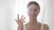 Attractive Woman Counting To Five On Fingers