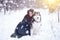 Attractive woman with the dogs. Fairy tale girl with Huskies or Malamute. Christmas