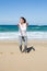 Attractive woman doing cross-fit on the beach