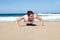 Attractive woman doing push-ups on the beach