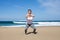 Attractive woman doing sit-ups on the beach