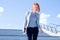 Attractive woman down the stairs with tablet against the sky