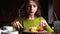 Attractive woman eating lunch in cafe