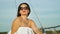 Attractive woman enjoying voyage of sailing boat