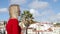 Attractive woman enjoys the view over Alfama - the historic district of Lisbon