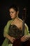 Attractive woman in evening dress with cello