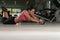Attractive Woman Exercise With Wheel Roller For Abs