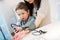 Attractive woman and her kid with a blood pressure meter tonometer