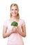 Attractive woman holding broccoli