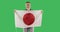 Attractive woman holding a Japanese flag on chroma key green screen.