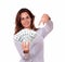 Attractive woman holding and pointing money