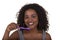 Attractive woman holding toothbrushes