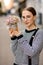 attractive woman holds pot with colorful gypsophila flowers in her hands