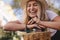 Attractive woman laughing outdoors with her bike