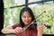 An attractive woman learning musician plays the violin at home. Composer creating songs with string instruments. Dreamy violinist