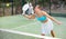 Attractive woman padel tennis player training on court